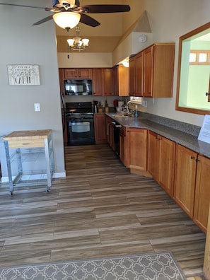 kitchen opens to living room and large eat in dining area. 