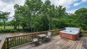 Enjoy views of the river and the mountain, while soaking in the hottub