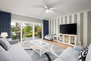 Living room with smart TV and lake view