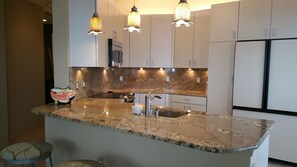 Lots of light for working and entertaining. Granite countertops