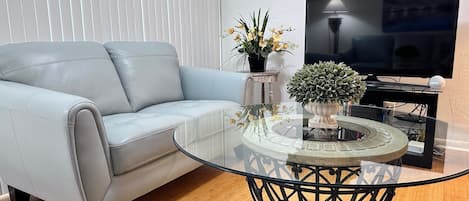 Living area with new leather Love Seat and Sofa