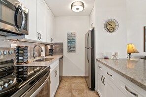 Newly installed practical kitchen with new appliances, Vitamix and spices