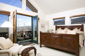 Ahh, a quiet master bedroom at the top of the house, looking out at snowy peaks!