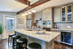 Showcase kitchen w/huge island countertop,  Krauss sink & Schuler cabinetry