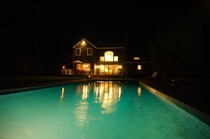 Backyard pool at night