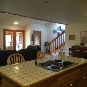 Entry, sunroom & stairs from kitchen