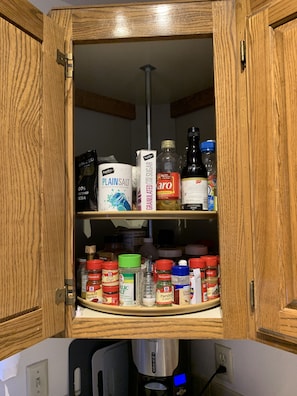 Lots of spices and necessities for cooking.
