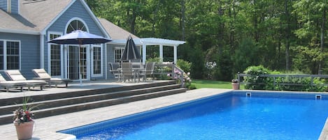 Oversized heated pool with large deck, hot tub and outdoor shower