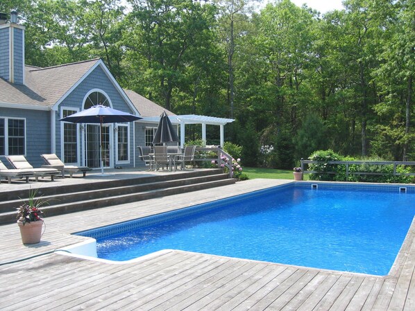 Oversized heated pool with large deck, hot tub and outdoor shower
