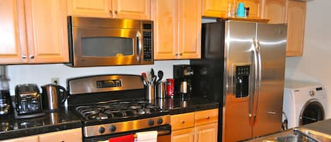 Fully equipped and remodeled Kitchen w/ Granite & stainless steel appliances.