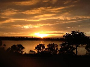 Sunset view from our yard/firepit area  and living room over marsh!  