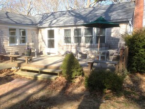 Deck with umbrella table and chairs, fire pit off deck