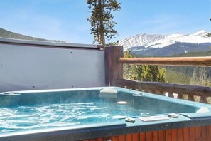 The hot tub and deck, perfect for relaxing after a hard day of skiing or hiking.