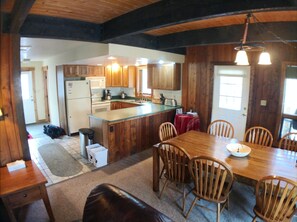 The kitchen is fully equipped, the dining area seats 8 around a hand-made table.