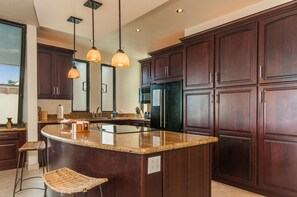 Well-stocked modern island kitchen