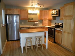 A nice, fully equipped kitchen, featuring all of the comforts of home.