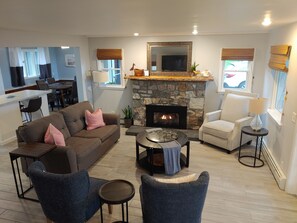 living room view from the stairs with gas fireplace insert