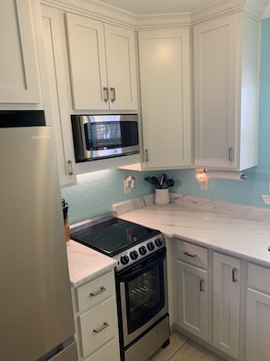 Granite countertops, new cabinets and stainless steel appliances 