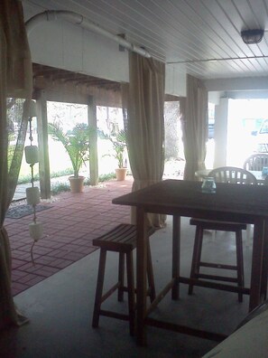 Under the house-- room for grilling or just hanging out.