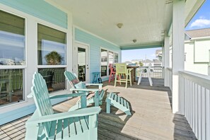 Large covered deck overlooking water and the bay sunsets