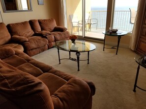 den with old flooring and couch (kept to show view)