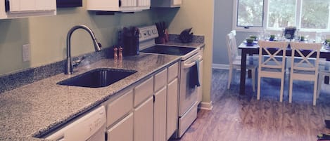 Kitchen, new floor, paint, lights, counters, etc