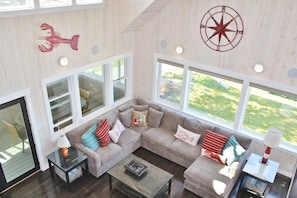 View of livingroom with cathedral ceiling from 2nd floor balcony