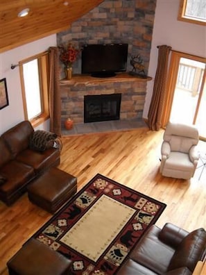 Living room view from upstairs, gas fireplace, mountain views, large screen tv
