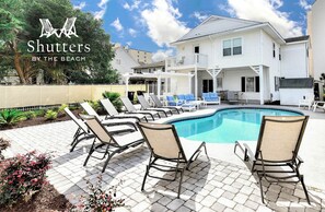 Shutters By The Beach has a large private pool and plenty of outdoor seating