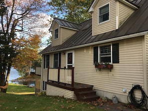 House front, lakeside to left.
