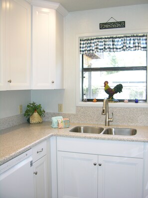 Brand new cabinets with self closing drawers/cupboards and recessed lighting.