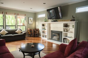 Living Room with Fireplace and 60' TV