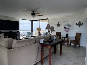 Spacious Living Room w 75" Samsung Smart TV, View from Bay to Gulf Balconies