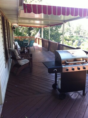 Covered deck over looking water; rain or shine the weather is great at the lake