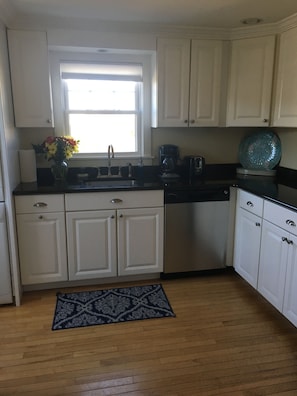 Kitchen with granite countertops & recessed lighting