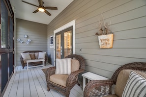 The screened front porch is everyones favorite spot to relax.
