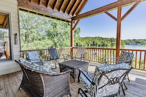 Beautiful covered back porch with panoramic lake views