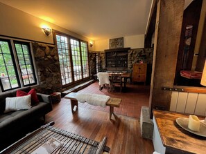 View from living room to connected dining area and outdoor patio