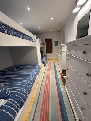 Comfortable bunk room with 2 x Double beds on top, 2 x Queen beds on bottom