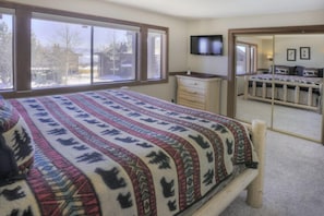 Log bed and mountain themed furniture in the master. Enjoy the flat screen TV.