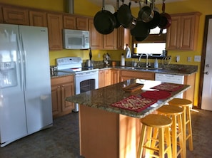 Kitchen is completely stocked. All appliances are new with granite countertops. 