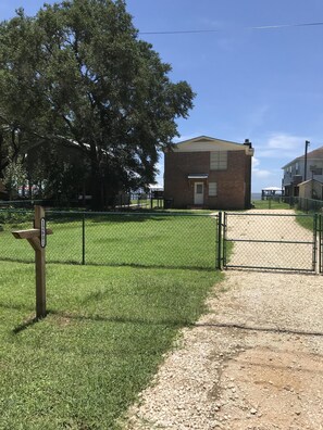 Parking and fenced in yard for pets on street side