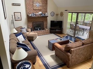 Open and bright living room with access to the screened porch