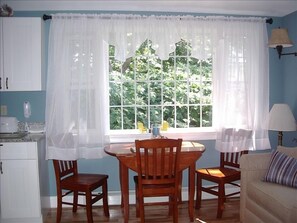 Drop leaf table with seating for 4; view from the picture window