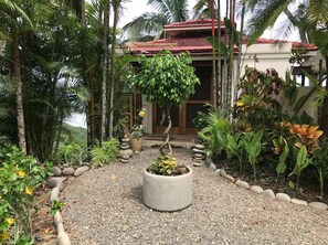 GARDEN ENTRANCE WITH PLENTY OF PARKING OUT FRONT