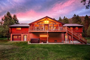 Rear exterior, hot tub patio, firetable and grill on deck, breathtaking sunsets.