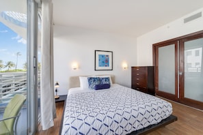 Bedroom with King Size bed with Balcony and Partial Ocean View