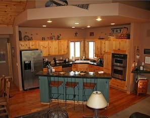 Bright well equipped kitchen open to the Great Room.  Seating for 3.