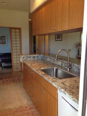 Newly remodeled kitchen with granite counters and bamboo cabinets