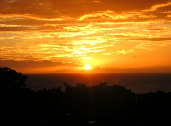 Sunset photo taken from our spacious lanai -- direct ocean view